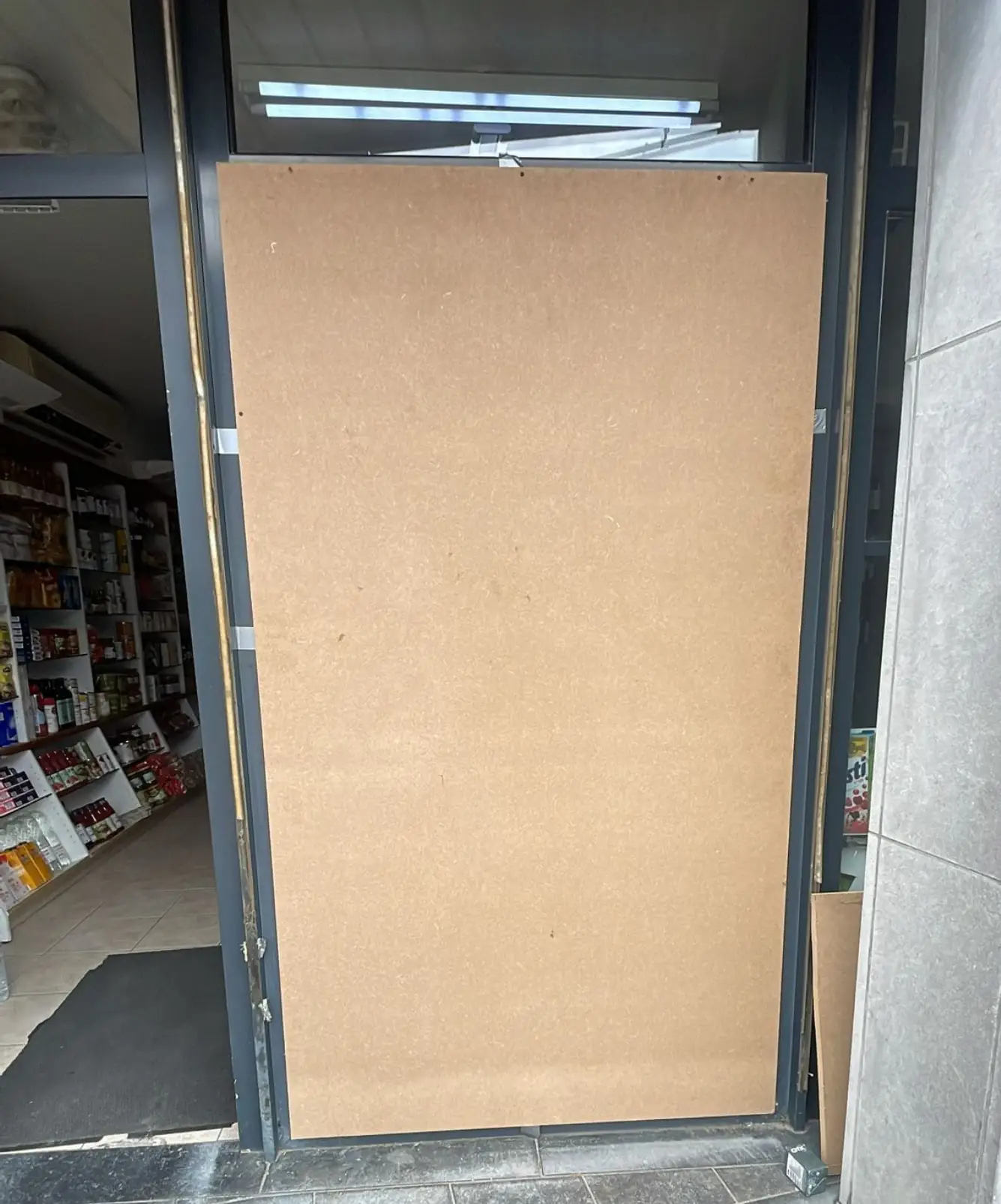 a door with a large cardboard board